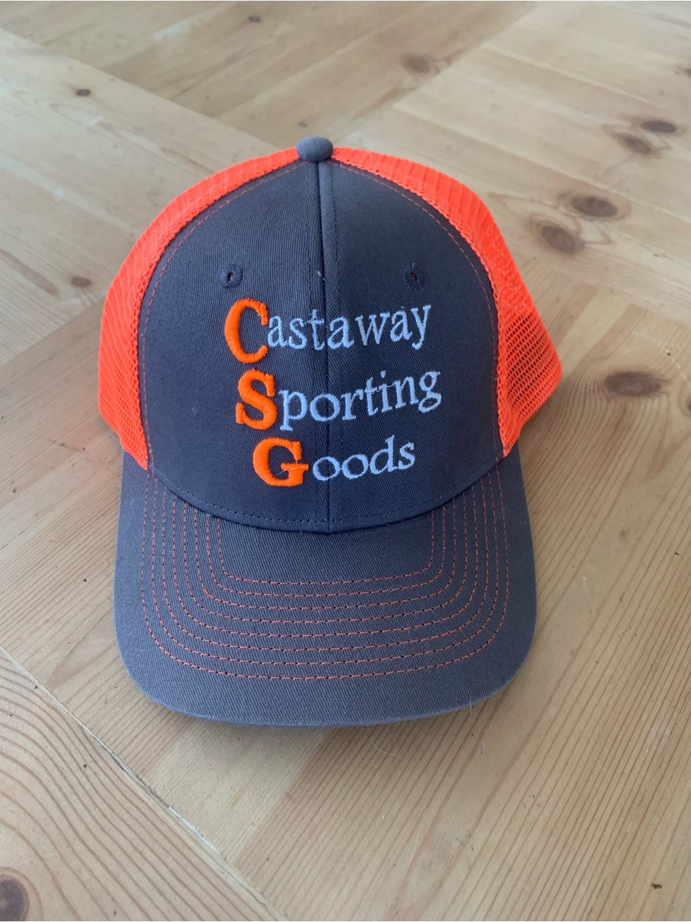 Castaway Sporting Goods Gray & Orange Trucker Hat Embroidered Mesh Visibility